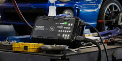 Noco GENIUSPRO50 Battery Charger; For 6 Volt/ 12 Volt/ 24 Volt Batteries; 100 Volt To 240 Volt AC/ 50 To 60 Hz; 50 Amp Charging Current (6 Volt And 12 Volt)/ 25 Amp Charging Current (24 Volt); 12.3 Inch Length x 3.6 Inch Width x 6.9 Inch Height; With One Genius PRO Clamps With Integrated Eyelets/ One 10 Foot Extension Cord/ One EVA Case/ Two Self-Tapping Screws/ Type A/ C/ G/ And I Power Cables