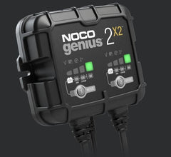 Noco GENIUS2X2 Battery Charger; Genius ®; For 6 Volt/ 12 Volt Batteries; 2 Bank Charger; 120 To 240 Volt AC Power Supply; 4 Amp Charging Current; 50 To 60 Hertz Frequency; -4 To 104 Degree Fahrenheit; 5.2 Inch Length x 1.9 Inch Width x 4.4 Inch Height; With Two Interchangeable Connectors/ Two Clamps With Integrated Eyelets/ Two 10 Foot Extension Cords/ Two Self-Tapping Screws/ Type A/ C/ G And I Power Cables